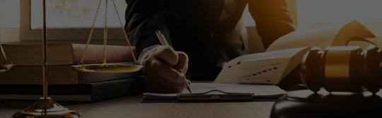 a man writing on paper