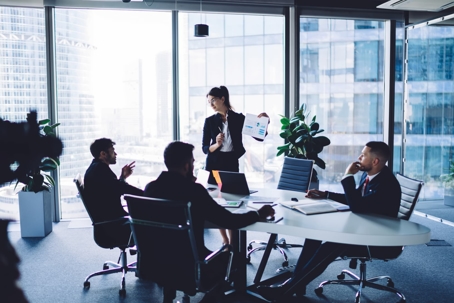 employees working in office meeting