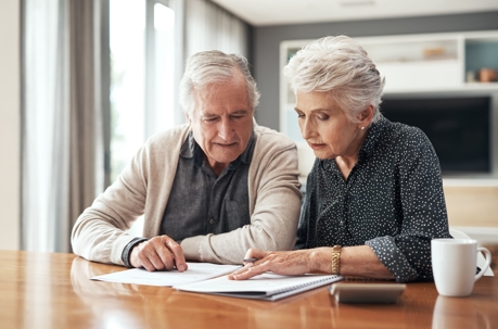 Old couple reading a paper