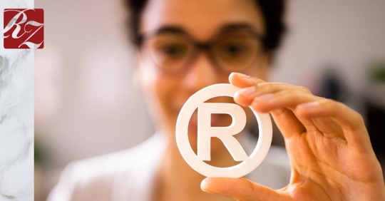 Woman holding up IP sign